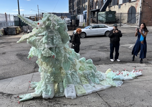 The Creature opens its mouth wide during a performance at CENTRAL BOOKING's On the Waterfront: A View from the Coast (Line), Red Hook, Brooklyn.