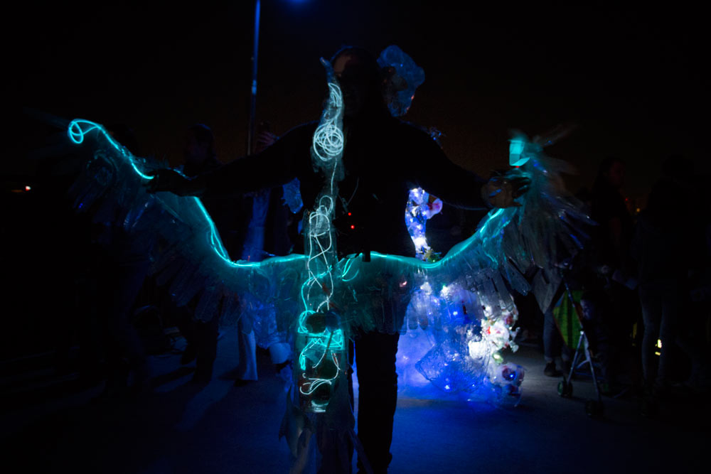 A crowd follows Margaret Craig's The Albatross onto San Antonio's Hays Street Bridge - Luminaria 2016